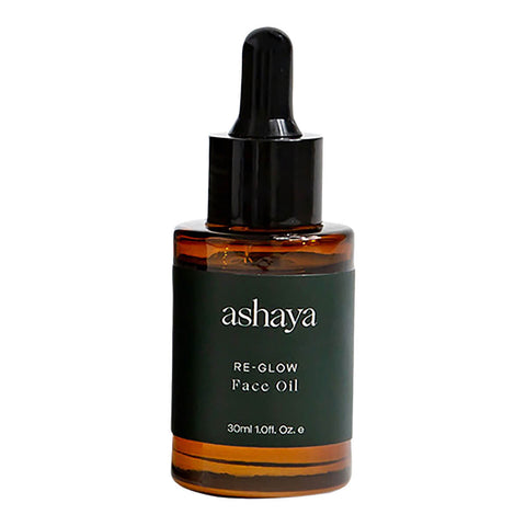 30ml dropper bottle of ashaya Re-Glow Face Oil, a formula designed to support the skin during the perimenopausal and menopausal years. This nutrient-rich botanical oil is infused with precious ingredients to help address the visible signs of aging, dark spots, dryness, and inflammation. Gently scented to soothe you throughout perimenopause. Suitable for all skin types.