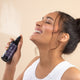 Woman spraying 50ml bottle of Edible Beauty No.2 Citrus Rhapsody Toner Mist, hydrates, smooths, and firms skin tone for a dewy complexion. With Green tea, niacinamide. and Australian desert lime.