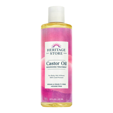 237ml bottle of Heritage Store Castor Oil Nourishing Treatment, a 100% cold-pressed treatment for body, hair and eyebrows. Packed with omegas, minerals, and ricinoleic fatty acids, promotes fuller-looking, stronger, and shinier hair. Ideal for all skin types. Packaged in a clear plastic bottle made of PCR packaging with a pink label.