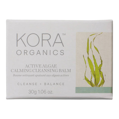 30g box of KORA Organics Active Algae Calming Cleansing Balm, a cleanser with microalgae, pineapple enzymes, jojoba and squalane that cleanses away makeup, dirt and oil for a clearer, more balanced complexion. Packaged in a white box with an illustration of algae on the front.