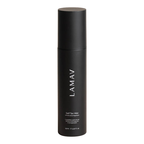 150ml bottle of LAMAV Self Tan Mist, a quick-dry tan for the face and body infused with magnesium to support wellbeing and skin health. Packaged in a black bottle with a spray nozzle.