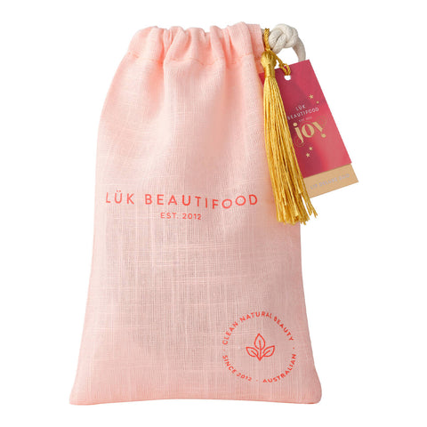 Luk Beautifood Lip Duo Deluxe Pouch - Nude Rose, a gift pouch containing Lip Nourish in shade Rose Lime and Lipstick Crayon in shade Lychee Sorbet. Packed ready to give in an eco-cotton keepsake pouch with tag + tassel ready to gift or keep.