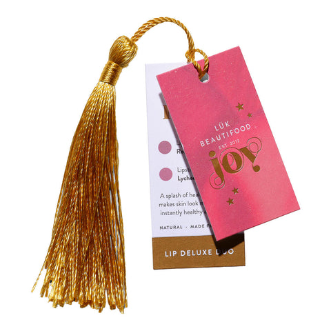 Luk Beautifood Lip Duo Deluxe Pouch - Nude Rose tag and tassle, a gift pouch containing Lip Nourish in shade Rose Lime and Lipstick Crayon in shade Lychee Sorbet. Packed ready to give in an eco-cotton keepsake pouch with tag + tassel ready to gift or keep.