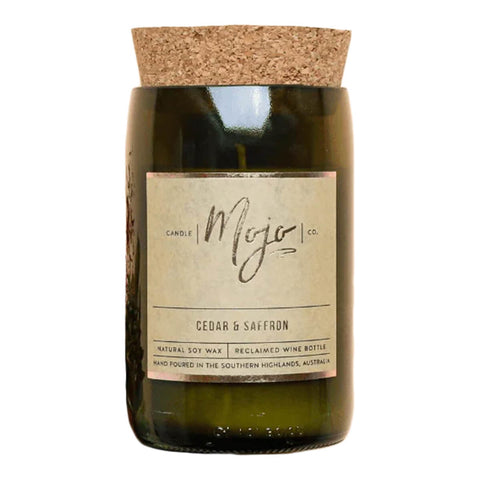 Mojo Candle Co. cedar and saffron scented candle, hand-poured into a reclaimed wine bottle with natural soy wax.