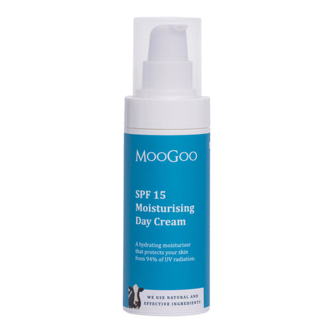 75g bottle of MooGoo SPF15 Moisturising Day Cream with a push pump, a hydrating moisturiser designed to protect your skin from 94% of UV radiation. Includes clear zinc and red raspberry seed oil. Packaged in a white bottle and a blue label with a cow illustration.