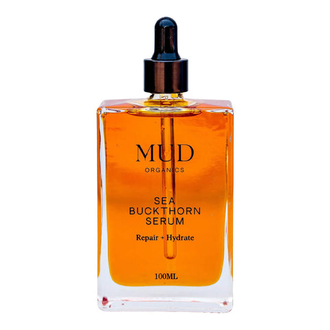 100ml glass dropper bottle of Mud Organics Sea Buckthorn Serum, a hydrating and nourishing formula that improves the aging process, repairs sun damaged skin, and helps diminish hyperpigmentation.