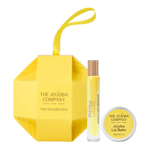 The Jojoba Company The Golden Duo holiday gift set. Includes Linden Blossom Signature Perfume 10ml and Jojoba Lip Balm 10g.