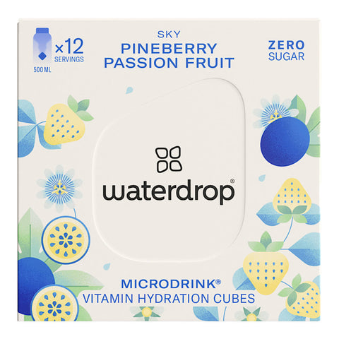 Box of 12 waterdrop Microdrink cubes in the Sky flavour, featuring pineberry and passionfruit. These sugar-free hydration cubes are made with natural fruit and plant extracts, providing a vitamin-enriched, flavoured drink. Each cube dissolves to create 400-600ml of a refreshing beverage. The product comes in a white box with blue and yellow pineberry and passionfruit illustrations on the front.