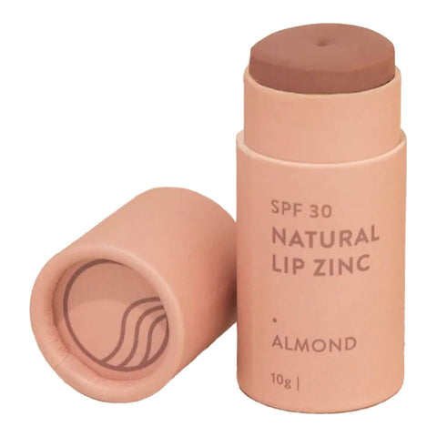 10g stick of Winki Zinc's Tinted Lip Zinc, a mineral-based lip balm designed to heal and protect your lips from the sun while adding a hint of natural colour. Shade Almond, a very subtle, light neutral colour. Perfect for a “nude” look or as a highlighter (light pigment).