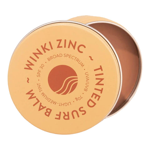 70g tin of Winki Zinc Tinted Surf Balm, a reef safe and water resistant zinc made with natural ingredients, including beeswax and cocoa butter.